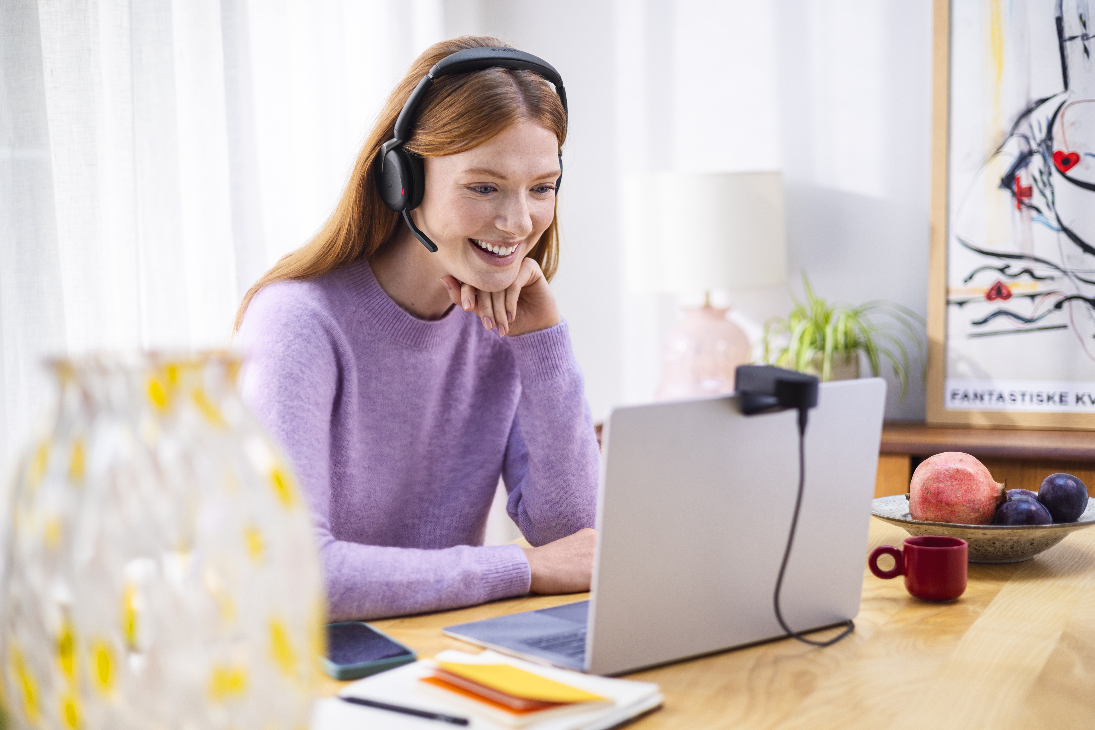 Jabra Evolve2 65 Flex _Female Working at Kitchen Table Medium
